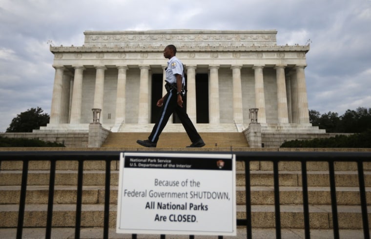 A National Parks policeman walks past a sign after the Lincoln Memorial was sealed off from visitors in Washington on Oct. 1.
