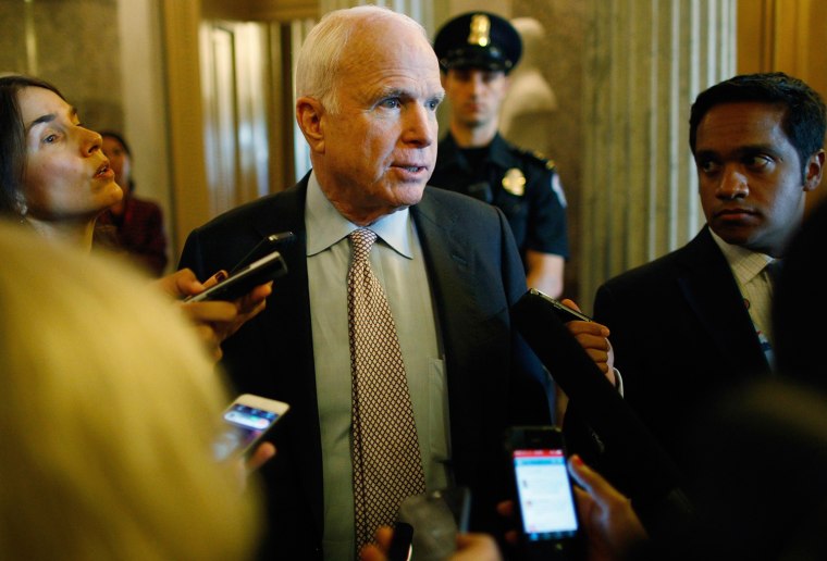 U.S. Senator John McCain talks to reporters after the Senate passed a bill to temporarily continue funding the government on Sept. 27. The bill was rejected by the House of Representatives.
