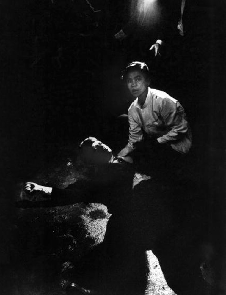 Bill Eppridge photographed Senator Robert Kennedy sprawled semiconscious in his own blood on floor after being shot in the brain & neck while busboy Juan Romero tries to comfort him.