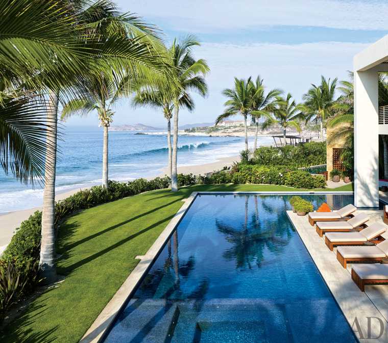 The November issue of Architectural Digest gives a glimpse into a vacation compound in Mexico featuring a pair of homes owned by George Clooney and Cindy Crawford and her husband that include outdoor pools with stunning views of the Pacific Ocean.