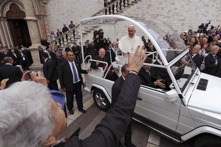Pope Francis leaves St. Francis Basilica at the end of a Mass in Assisi on Friday.