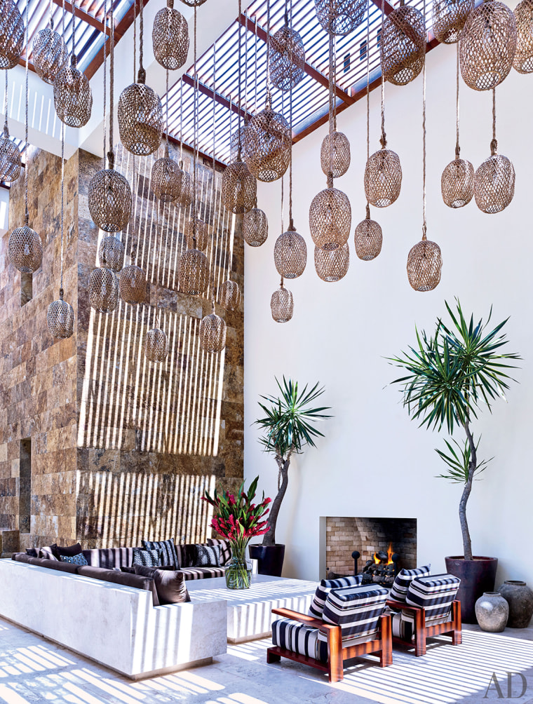 Architectural Digest editor-in-chief Margaret Russell described Clooney's home in the compound as \"more clubby, more masculine,\" with more brown colors. Here is a look at his courtyard area.