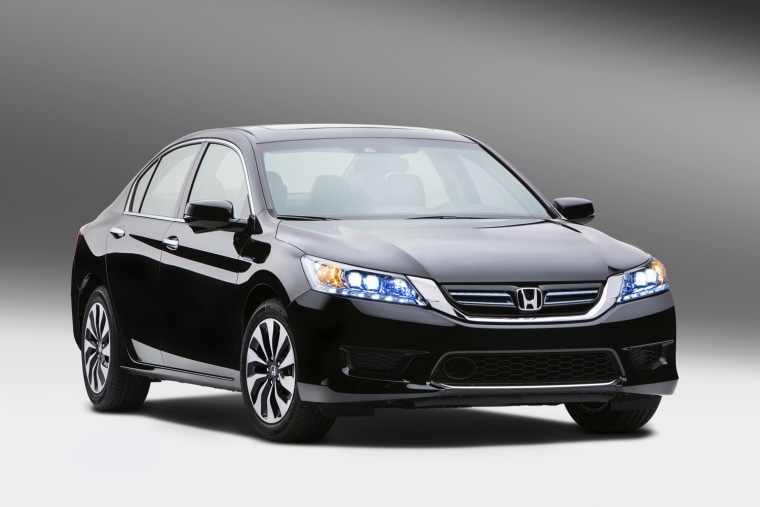 This undated publicity photo provided by American Honda Motor Co., Inc. shows the 2014 Honda Accord Hybrid. Honda says the hybrid, which goes on sale ...