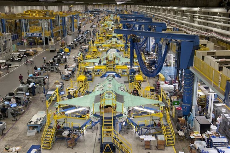 Workers can be seen on the moving line and forward fuselage assembly areas for the F-35 Joint Strike Fighter at Lockheed Martin Corp.'s factory in Fort Worth, Texas, in this Oct. 13, 2011, photo. Lockheed said it will furlough 3,000 workers on Monday because of the government shutdown.