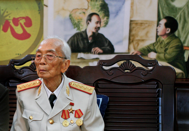 Vietnamese Gen. Vo Nguyen Giap is seen in front of a painting of himself and president Ho Chi Minh, left, at his home in Hanoi, Vietnam in this picture taken Aug. 25, 2008, his 97th birthday.