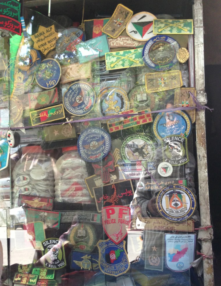 Afghan military badges are displayed at a market in Kabul.