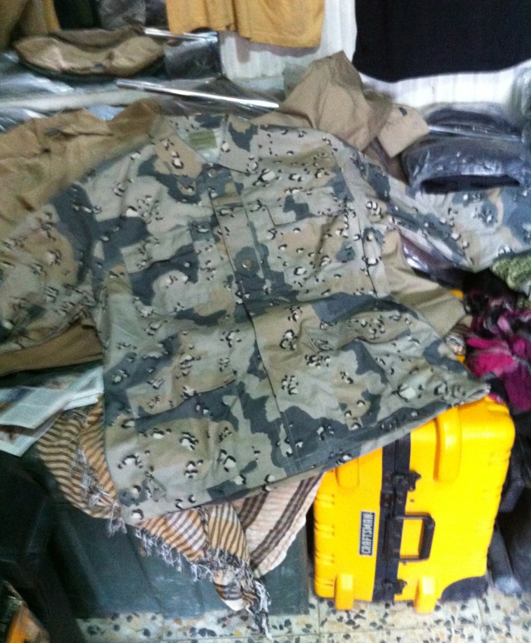 Afghan military uniforms are displayed at a market in Kabul.