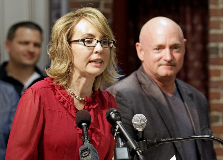 Former Arizona Rep. Gabrielle Giffords, accompanied by her husband, retired astronaut Capt. Mark Kelly, speaks during a news conference at the Millyard Museum, Friday, July 5, 2013, in Manchester, N.H.