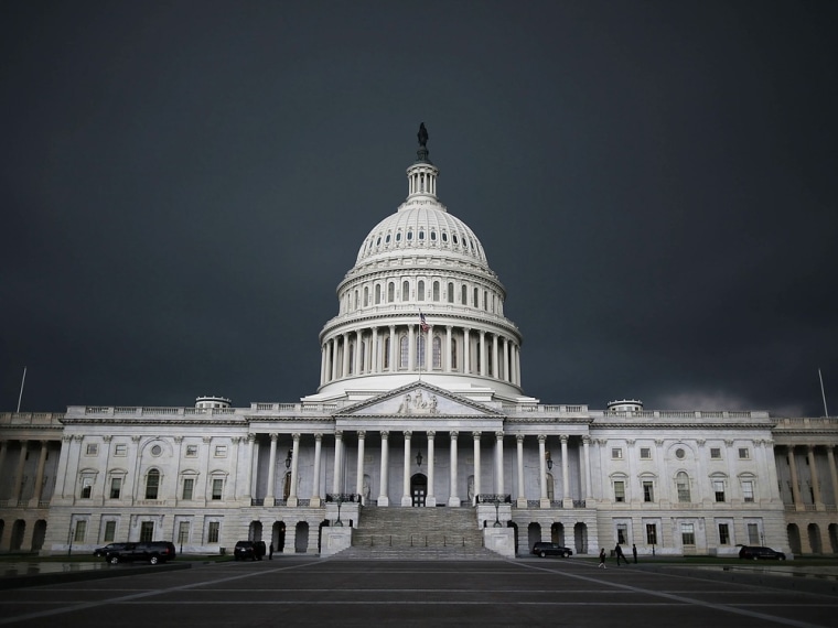 WASHINGTON, DC - JUNE 13: Storm clouds fill the sky over the U.S. Capitol Building, June 13, 2013 in Washington, DC. Potentially damaging storms are ...