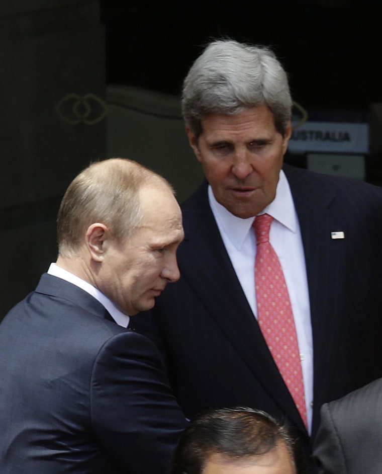 Secretary of State John Kerry with Russian President Vladimir Putin as they gather for the traditional