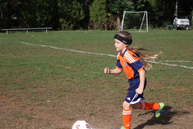 n 8-year-old girl wears Storelli protective head gear while practicing with the Manhasset Soccer Club in Long Island, N.Y.