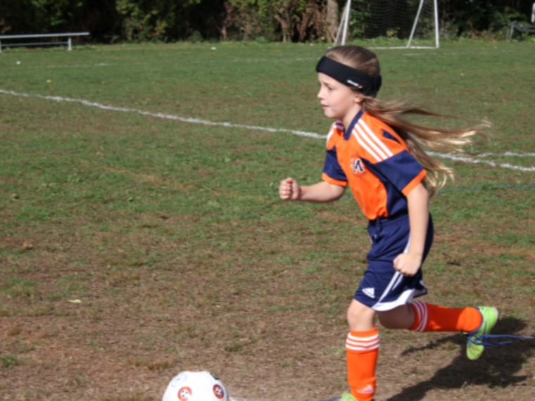An 8-year-old soccer player, whose name was withheld by her mother, with the Manhasset Soccer Club in Long Island, N.Y.