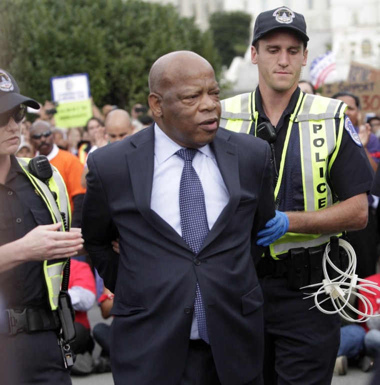 Representaive John Lewis (D-GA) is arrested on Capitol Hill in an act of civil disobedience to encourage support of immigration reform, October 8, 2013 on The National Mall in Washington DC as thousands rallied in support of immigration reform on the National Mall in Washington DC.
