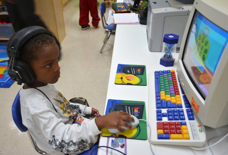 Nyzir Hanna, 4, plays on a computer at his Head Start program in Cobb County, Ga. The program re-opened Tuesday morning after being closed due to a lack of funding.