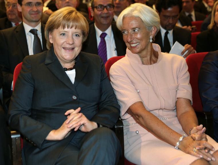 The other two: German Chancellor Angela Merkel (left) and Managing Director of the IMF Christine Lagarde.