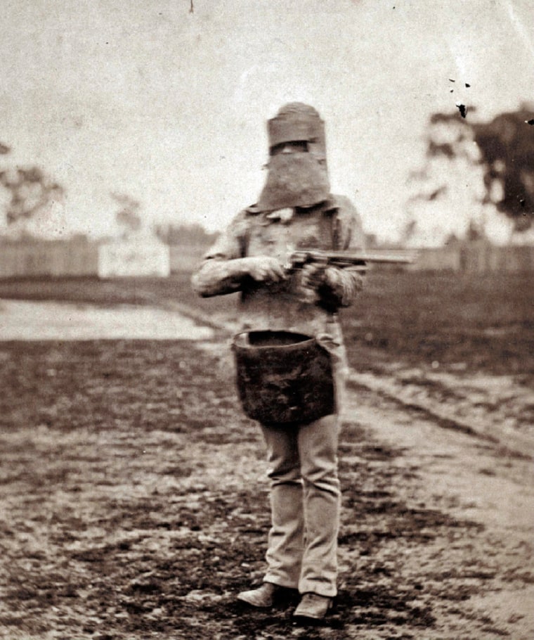 In this undated photo, Australia's most infamous criminal, Ned Kelly, holds a gun in Melbourne, Australia.