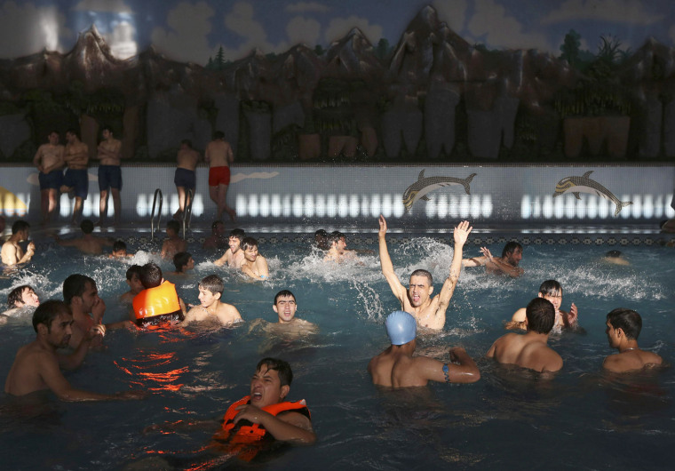Visitors enjoy a water park in Kabul on Oct. 4.