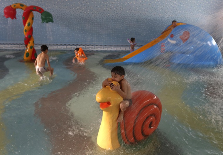 Children play at a water park in Kabul on Oct. 4.