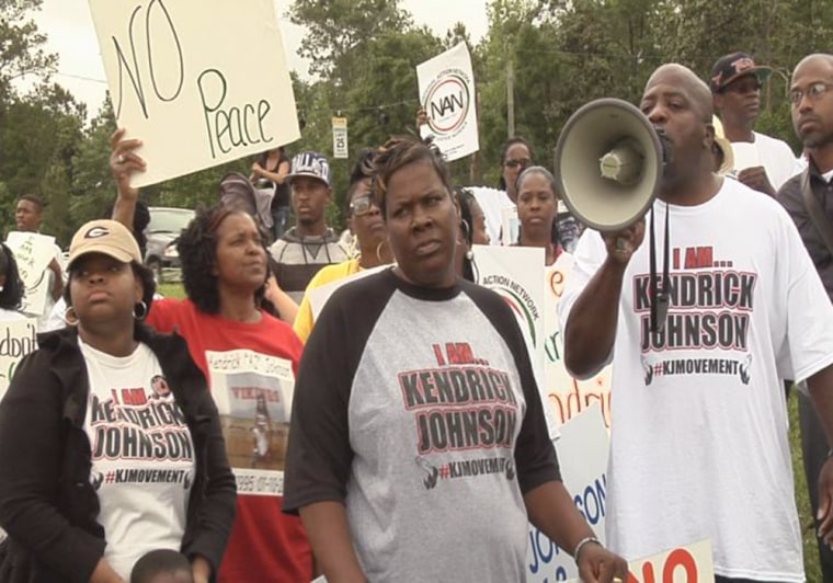 Family and friends of Kendrick Johnson and activists protest outside Lowndes High School in Valdosta, Ga., in May.