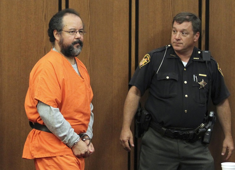 Ariel Castro (L), 53, enters the courtroom in Cleveland, Ohio in this July 26, 2013 file photo. Castro, the Cleveland man sentenced to life in prison for the abduction, rape and torture of three women, was found dead in his Ohio jail cell, according to a prison official on September 3, 2013. REUTERS/Aaron Josefczyk/Files (UNITED STATES - Tags: CRIME LAW OBITUARY)