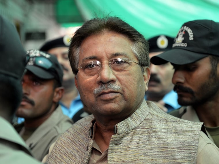 Former Pakistani president Pervez Musharraf is escorted by soldiers as he arrives at an anti-terrorism court in Islamabad in April.