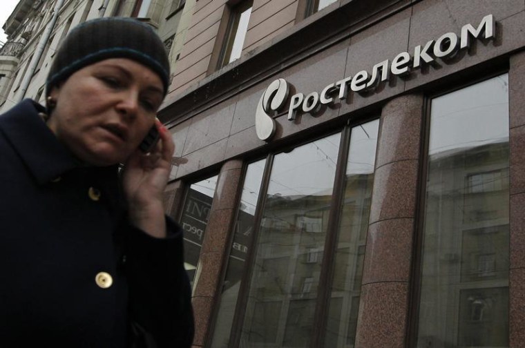 A woman passes by an office of Russian telecoms firm Rostelecom in Moscow, November 21, 2012. REUTERS/Maxim Shemetov