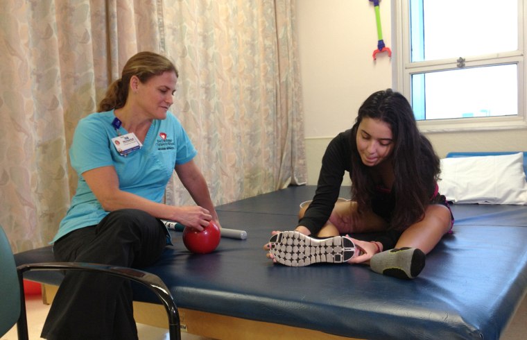 Jazzmin Peluchette and physical therapist Jill Macedo.