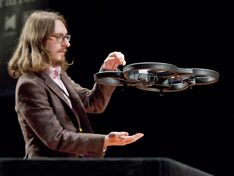 (10/11/2013) Julian Szajdzicki catches an AR Parrot 2.0 drone during a demonstration by Nodecopter at the DARC conference's AfterDARC session in NYU's...