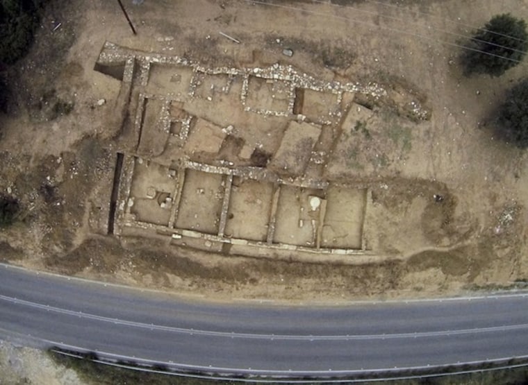 During excavations in the summer of 2013, archaeologists uncovered the portico of the ancient city of Argilos, which sits along the northern coast of the Aegean Sea in modern-day Greece. This aerial view shows the ruins that were excavated, including five of the seven storerooms that make up the portico.