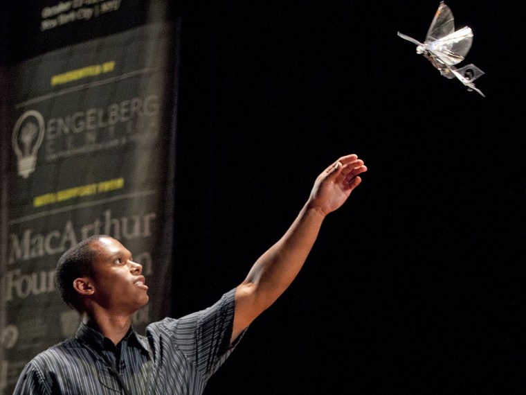 (10/11/2013) Cameron Rose, of UC Berkeley Biomimetric Millisys Lab, catches a drone resembling a bird at the DARC conference's AfterDARC session in NY...