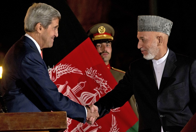 Secretary of State John Kerry shakes hands with Afghan President Hamid Karzai after a press conference at the Presidential Palace in Kabul on Saturday.