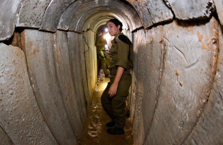 An Israeli soldier stands in the tunnel that the Israeli army reportedly discovered and seized on Oct. 7, 2013, near Kissufum, southern Israel, along the border with the Gaza Strip on Oct. 13, 2013. Israel announced it would halt the import of building materials into the Gaza Strip until further notice after it discovered a tunnel it said was built by Palestinian militants who wanted to launch an attack upon Israel.