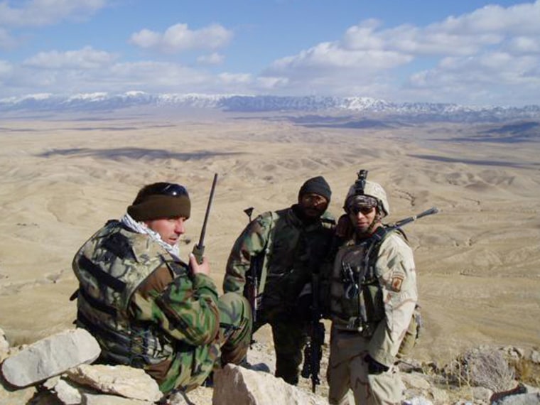 Ben Olmedo, right, a physician assistant, stands with Afghan National Army soldiers in Afghanistan. Olmedo went from Afghanistan to Alaska to start hi...