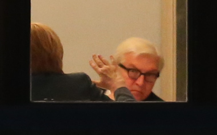 SPD Bundestag faction leader Frank-Walter Steinmeier, right, faces CDU Chairwoman Angela Merkel across the negotiating table.