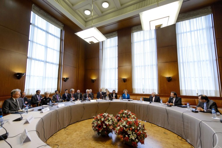 Iranian Foreign Minister Mohammad Javad Zarif (third from right) sits with world powers' delegations prior to the start of two days of closed-door nuclear talks in Geneva on Tuesday.