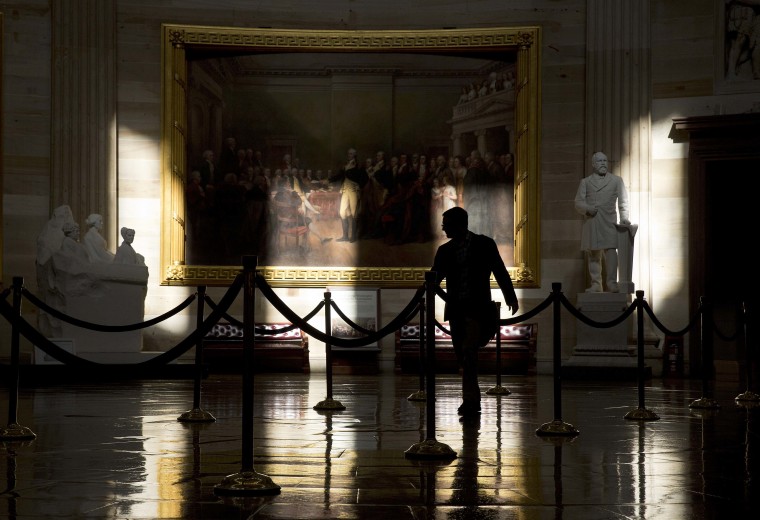 A man walks through the Rotunda of the U.S. Capitol during the partial government shutdown in Washington, Oct. 14, 2013. Even without a deal to extend the debt ceiling, the government will be able to pay bills beyond Thursday.