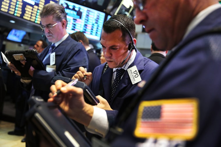 Traders work on the floor of the New York Stock Exchange on Wednesday.