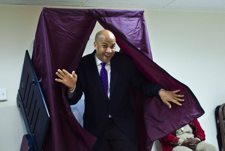 Newark Mayor and U.S. Senate candidate Cory Booker leaves a polling station after casting his ballot during the Senate primary election in Newark, New Jersey, October 16, 2013.
