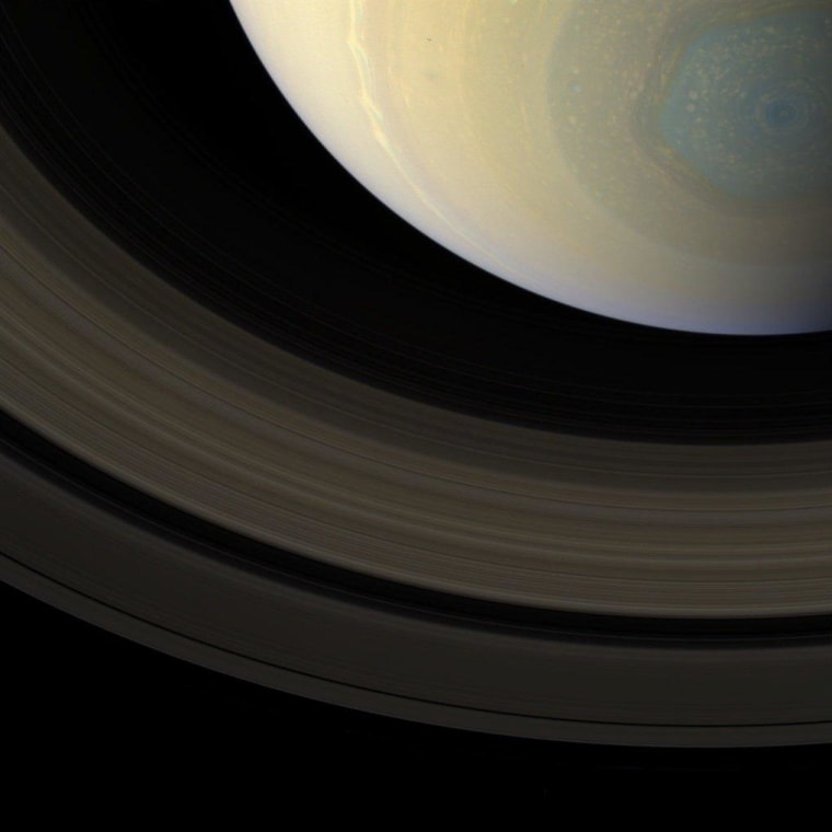 A true-color view from the camera on NASA's Cassini orbiter, captured on Oct. 10, shows Saturn's north polar region and its rings. The planet's mysterious hexagon-shaped polar storm can be seen in bluish shades. This picture was taken from a distance of about 935,000 miles (1.5 kilometers).