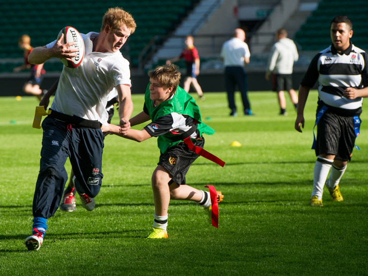 Image: Prince Harry playing football