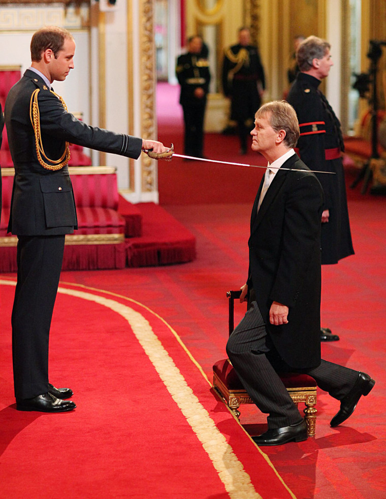 Headteacher Sir Kenneth Gibson from Jarrow receives his Knighthood from Prince William, Duke of Cambridge, during an Investiture ...