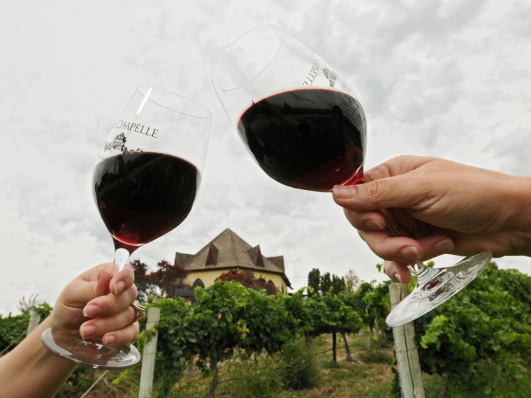 In this undated photo, people hold wine glasses containing 2012 Cabernet Sauvignon at Sunnyslope's Ste. Chapelle Winery in Caldwell, Idaho. Agritouris...