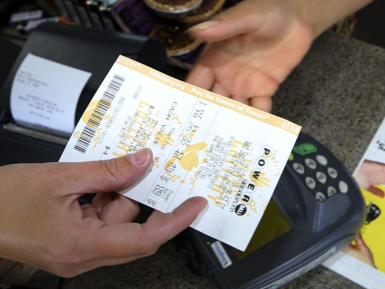 A Powerball lottery ticket is purchased at the Fuel City store in Dallas on Wednesday, Sept. 18, 2013. For Wednesday's drawing, Powerball's estimated ...