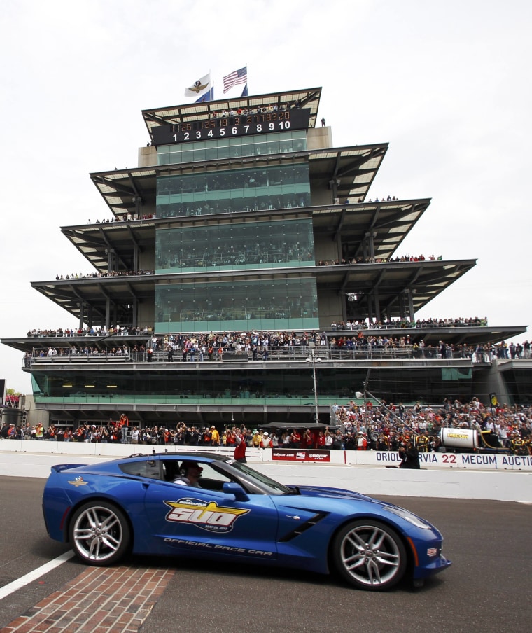 A 2014 Chevrolet Corvette Stingray passes by the grandstands as it paces the 97th running of the Indianapolis 500 at the Indianapolis Motor Speedway in Indianapolis, Ind., May 26, 2013.