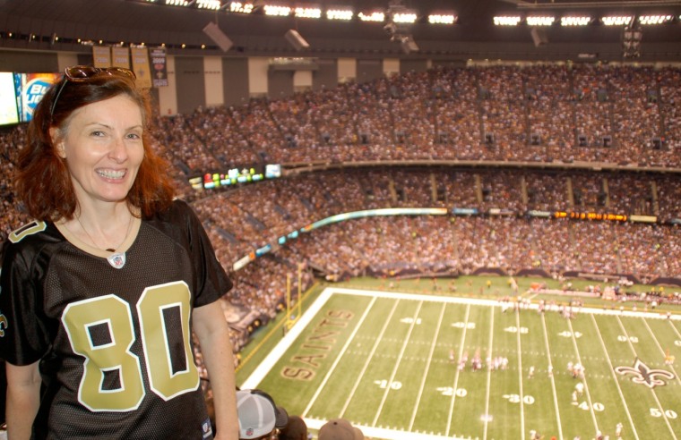 Lynda Woolard, a diehard New Orleans Saints fan, believes the NFL should receive no tax exemption. Her online petition to strip that tax break from the league has garnered more than a quarter million signatures. She's wearing a Jimmy Graham jersey at the Superdome.