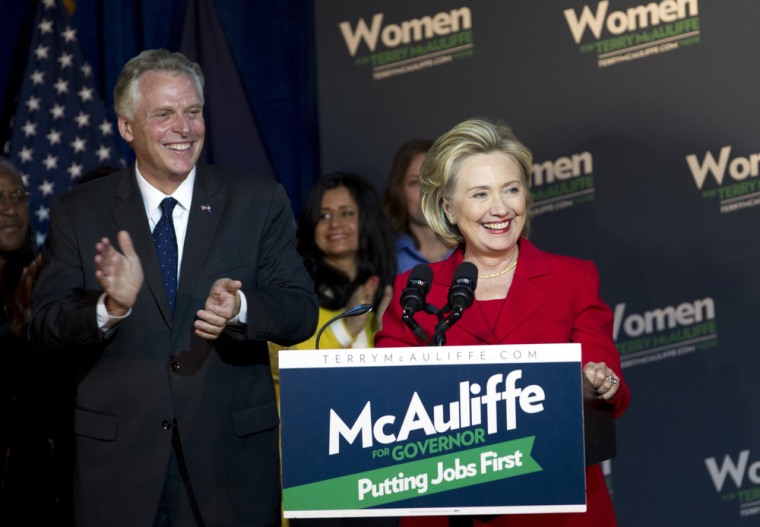 Former Secretary of State Hillary Rodham Clinton campaigns for Virginia gubernatorial candidate, Democrat Terry McAuliffe, left, at a Women for Terry rally at the State Theater in Falls Church, Va., on Oct. 19.