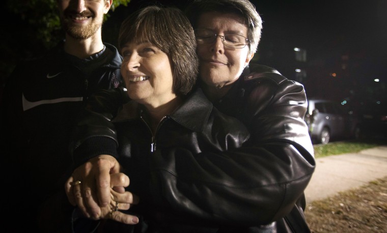 Cindy Meneghin (R) and her partner Maureen Kilian hug after a marriage equality rally in Montclair October 18, 2013. Same-sex couples in New Jersey will be able to wed starting on Monday, after the state's highest court unanimously denied Governor Chris Christie's request to put gay marriage on hold while the state's appeal is heard.
