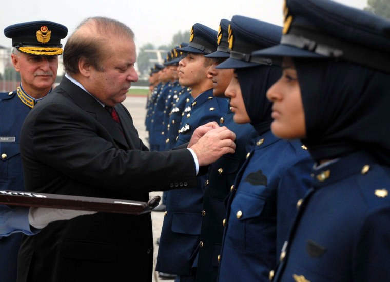 Pakistan's Prime Minister Nawaz Sharif awards branch insignias to male and female graduating officers during a graduation ceremony of Pakistan Air Force cadets in Risalpur, Pakistan on Oct. 14.