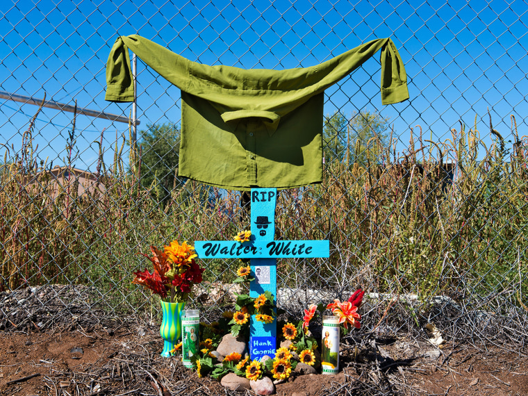 A \"descanso\" or roadside memorial set up by \"Breaking Bad\" fans outside an abandoned wood mill in Albuquerque, where Walter White met his end in the series' finale.