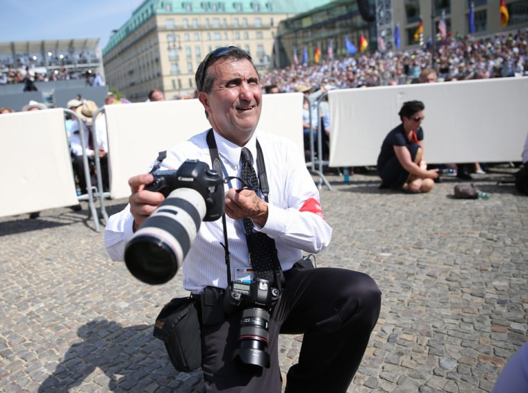 Official White House photographer Pete Souza waits for President Barack Obama to speak at the Brandenburg Gate in Berlin, Germany, in June.